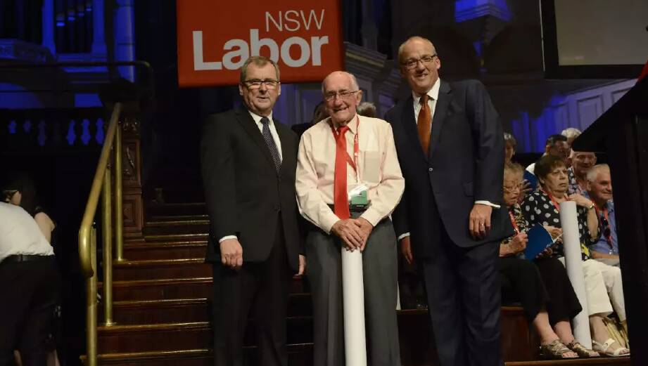 Flashback to 2016 and Neville Kelly receives a Labor Lifetime Award from then shadow minister Anthony Albanese and NSW opposition leader Luke Foley.