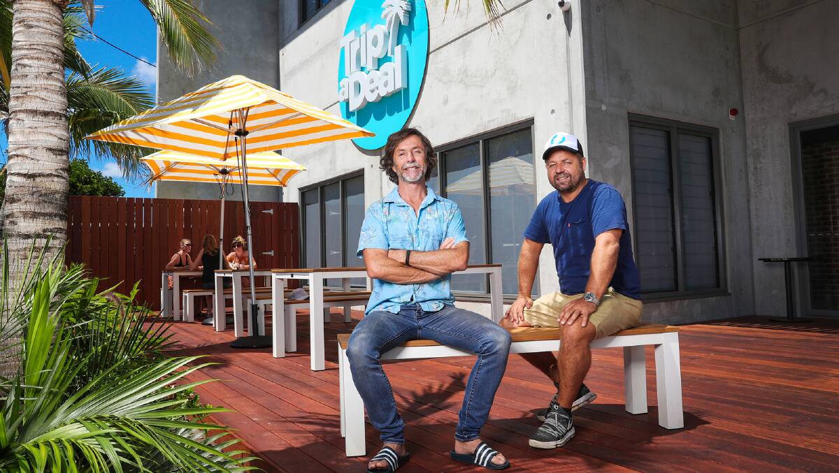 From left, co-founders Richard Johnston and Norm Black outside the TripADeal headquarters in Byron Bay. Picture supplied
