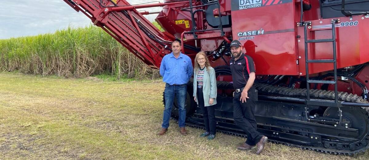 Co-op Chairman Pat OConnor (left) Janelle Saffin and Dan Hoppe from Days Machinery with the new cane harvester.