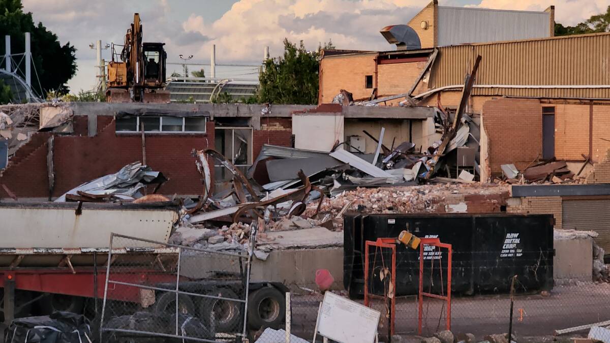 Demolition crews from Brisbane have torn down half of the building on Anzac Cl in Lismore. Picture: Cathy Adams