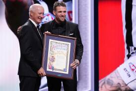 Hall of Fame inductee Dane Swan with AFL Commission chairman Richard Goyder. (Daniel Pockett/AAP PHOTOS)